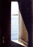 Looking through a slit in a fort wall
